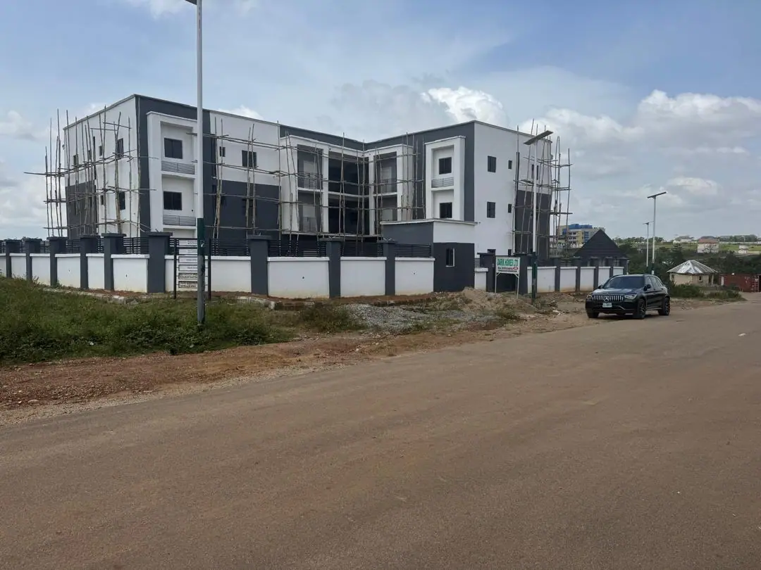 The Kaura District block in white and charcoal with timber scaffolding still standing